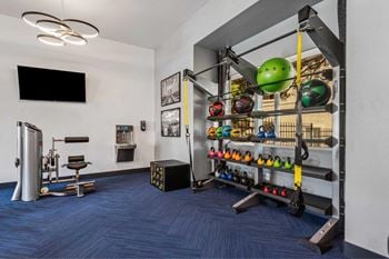 24-Hour fitness center with cardio and weight training equipment